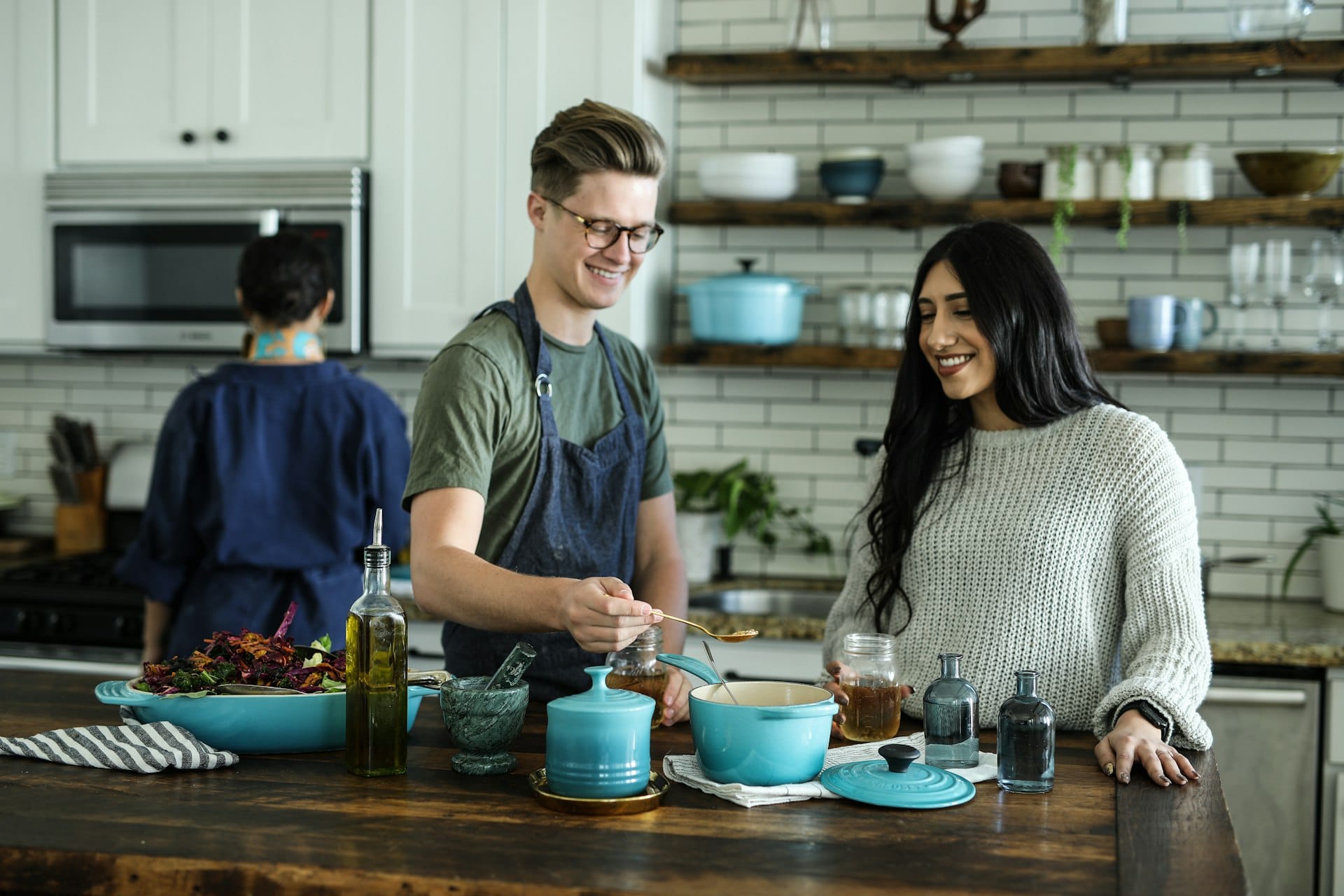 A couple cooking together in their home kitchen